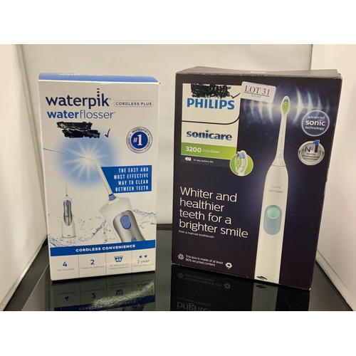 31 - BOXED PHILLIPS SONICARE 3200 SONIC TOOTHBRUSH TOGETHER WITH A WATERPIK WATER FLOSSER CORDLESS PLUS