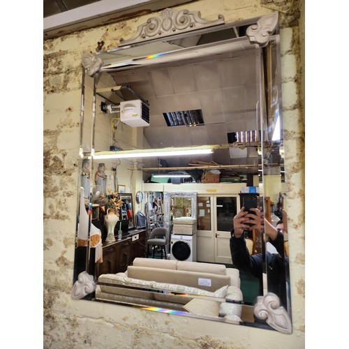 274 - A FRAMELESS GLASS ON GLASS RECTANGULAR MIRROR WITH IVORY STYLE PEDIMENT AND ANGLED CORNERS W:70CM H:... 