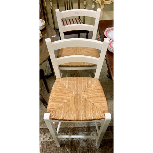 350 - A PAIR OF WHITE ENAMELLED & RATTAN SEATED HI-BACK BREAKFAST STOOLS