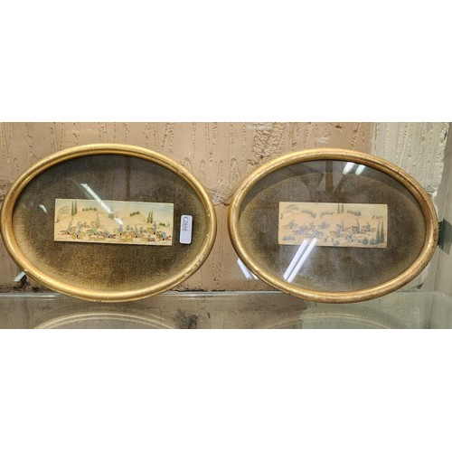 424 - A PAIR OF SMALL OVAL GILT FRAMED PERSIAN PAINTINGS ON BONE