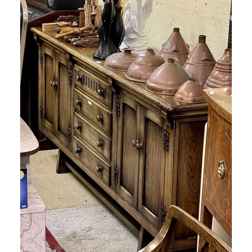 351 - AN ERCOL YEW SIDEBOARD OF 4 CENTRAL DRAWERS (INCL. CUTLERY DRAWER) FLANKED BY TWO DOUBLE DOOR CUPBAO... 