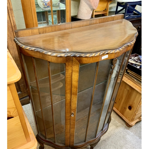 294 - WALNUT GLAZED HALF MOON DISPLAY CABINET ON QUEEN ANNE LEGS - 2 SHAPED GLASS SHELVES & KEY