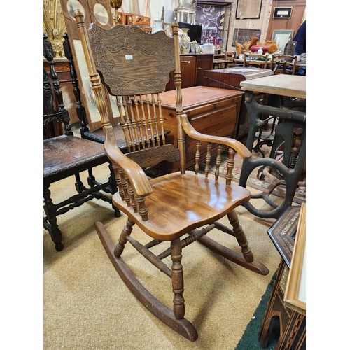 319 - AMERICAN STYLE OAK ROCKING CHAIR WITH CARVED DESIGN