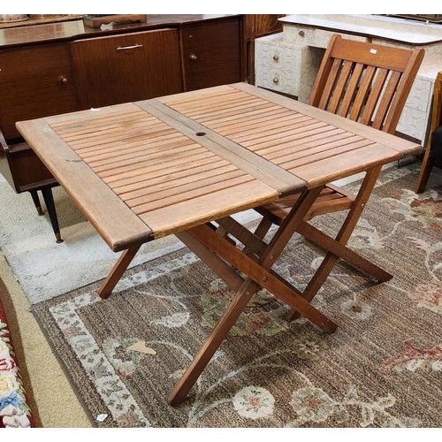 261 - A TEAK HARDWOOD FOLDING GARDEN TABLE  WITH A SINGLE MATCHING FOLDING CHAIR