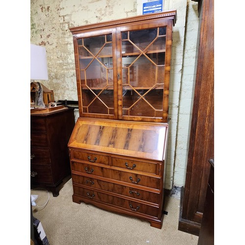 288 - YEW BUREAU BOOKCASE -ASTRAGAL GLASS BOOKCASE ABOVE DROPLEAF FITTED DESK - WITH 5 DRAWERS (2X SHORT -... 