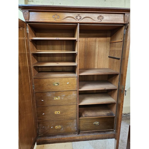 290 - LARGE OAK ARTS & CRAFTS LINEN PRESS WITH 1 SIDE SHELVED AND THE OTHER WITH 4 DRAWERS AND 3 SHELVES