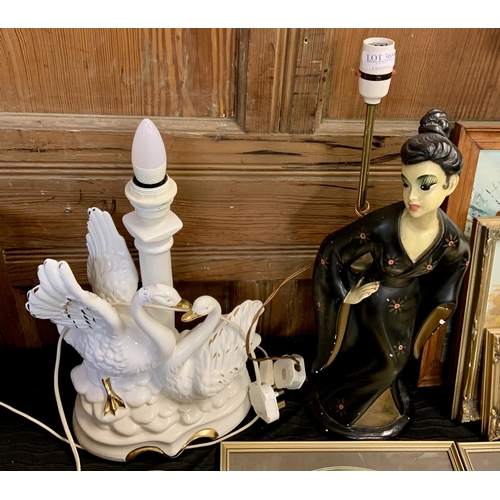 369 - 2X TABLE LAMPS -WHITE/GILT CERAMIC IN THE FROM OF A SWAN, AND A PLASTER FIGURINE IN BLACK/GILT, REGI... 