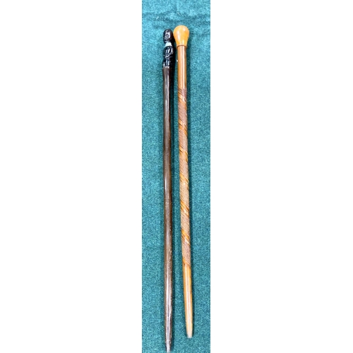 323 - 2 WALKING CANES, ONE WITH AFRICAN FIGURE HEAD, ONE ORIENTAL STYLE