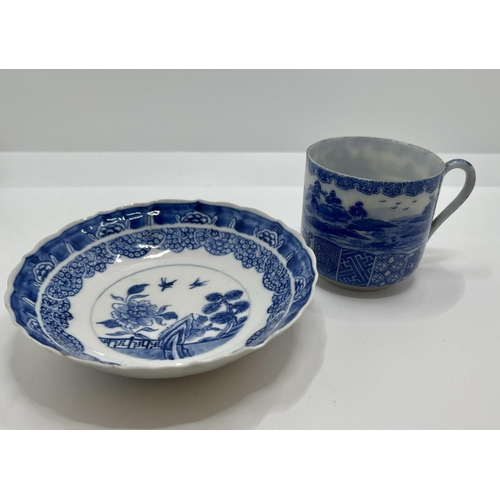 308 - A BLUE AND WHITE ANTIQUE CHINESE TEA CUP AND SAUCER