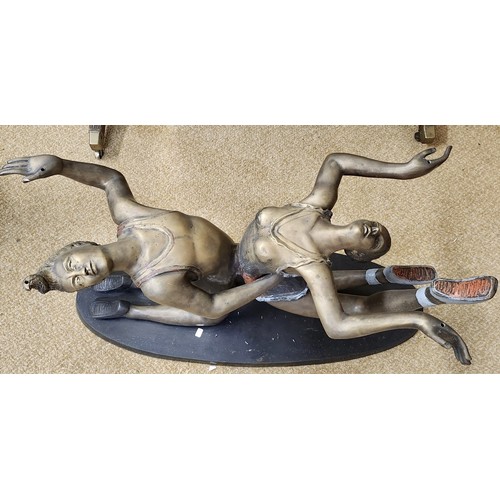 192 - BRONZE FIGURATIVE TABLE BASE - A PAIR OF CIRCUS ACROBATS IN THE FORM OF A TABLE BASE ON AN OVAL SUPP... 