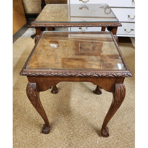 192 - NEST OF 2 TABLES ON CABRIOLE LEGS, WITH GLASS TOPS, DECORATION TO FRIEZE - 48CMW X 40CMD AND 38CMW X... 