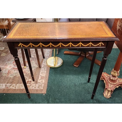 194 - LEATHER INLET TOPPED HALL TABLE WITH CARVED CLASSICAL DECORATION - 79CMW X 33CMD