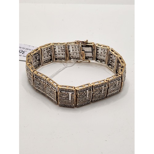 369 - A 9CT GOLD & DIAMOND ART DECO GREEK KEY PATTERN BRACELET