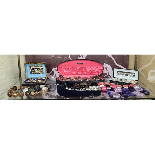373A - SHELF OF VARIOUS COSTUME JEWELRY INCL NECKLACES. BRACELETS. BROOCHES ETC