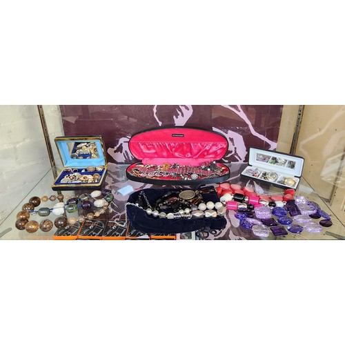 373A - SHELF OF VARIOUS COSTUME JEWELRY INCL NECKLACES. BRACELETS. BROOCHES ETC