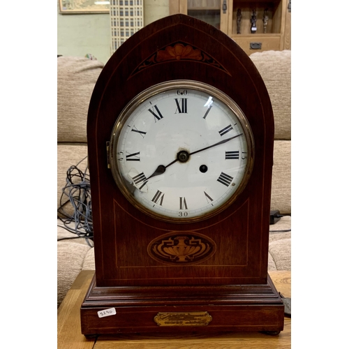 276 - AN ARCHED MAHOGANY MANTLE CLOCK - GOTHIC STYLE - ENAMELLED DIAL WITH DGE. WITH PLAQUE TO FRONT SAYIN... 