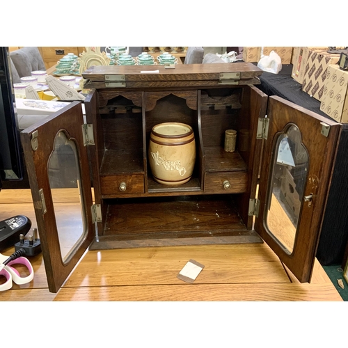 293 - A VINTAGE OAK CASED PIPE CABINET WITH ORIGINAL DOULTON LAMBETH TOBACCO JAR -