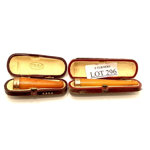 296 - 2 X CASED 9CT GOLD AND AMBER CIGARETTE HOLDERS