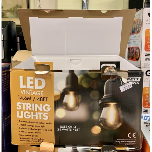 84 - BOXED SET OF FEIT ELECTRIC LED VINTAGE 48FT STRING LIGHTS WITH BULBS - CAN BE ATTACHED TO OTHER SETS