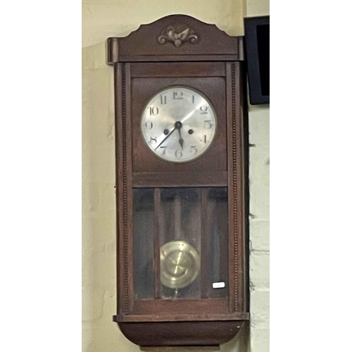 411 - A VINTAGE OAK CASED WALL CLOCK