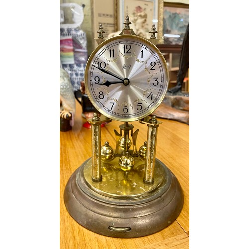 351A - LCHATZ BRASS CARRIDGE CLOCK ENCASED IN A GLASS DOME WITH KEY