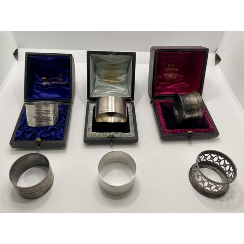 381 - PAIR OF SILVER NAPKIN RINGS H.M. CHESTER 1922 MM POSSIBLE EJ TREVITT & SONS TOGETHER WITH ANOTHER PA... 