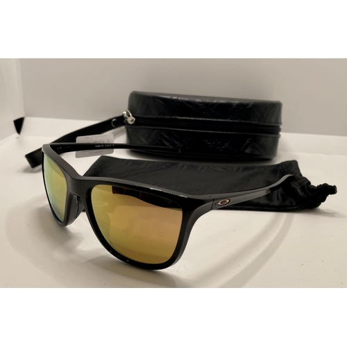 56 - PAIR OF OAKLEY REVERIE SUNGLASSES WITH POCHETTE AND CASE - EX DISPLAY