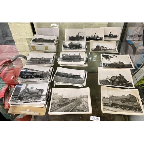 405 - A LARGE COLLECTION OF BLACK AND WHITE PHOTOGRAPHS OF VINTAGE STEAM TRAINS - MARKED TO REVERSE REAL P... 