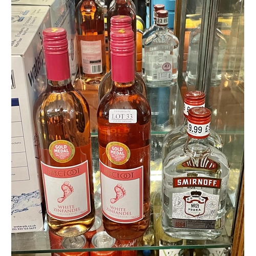 33 - 2 X BOTTLES OF SMIRNHOFF VODKA 350M TOGETHER WITH 3 X WHITE ZINFANDEL