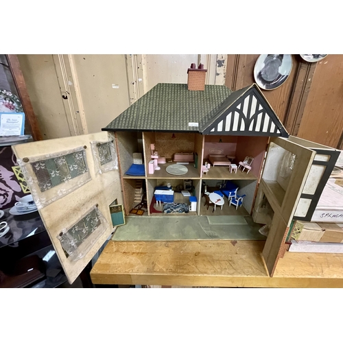 A VINTAGE DOLLS HOUSE LATER FURNITURE MOCK TUDOR STYLE WITH