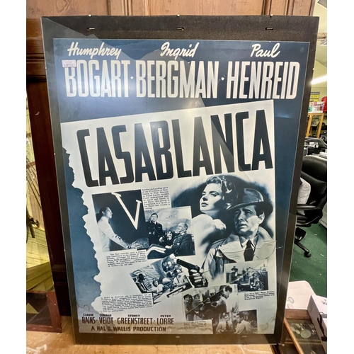 311 - FILM POSTER 'CASABLANCA' WITH HUMPHREY BOGART - 65CMW X 90CMH (CARE REQUIRED - CRACKED GLASS)