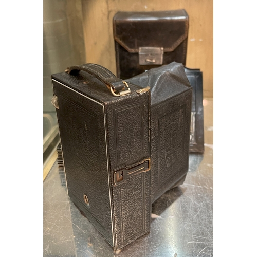 377 - A ZEISS IKON FOLDING CAMERA WITH CARRY CASE AND GLASS LENSES