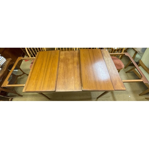 270 - AN EXTENDING DRAW LEAF MID-CENTURY G-PLAN DINING TABLE MARKED E. GOMME DANISH DESIGN WITH 2 EXTRA LE... 