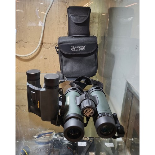 371 - A PAIR OF NIKON BX BINOCULARS AND CASE AND A PAIR OF HAWKE NATURE TREK BINOCULARS AND CASE