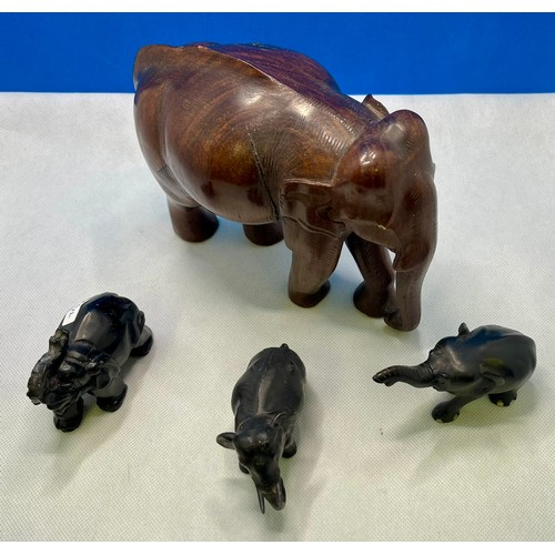 205 - 4X DECORATIVE ELEPHANT FIGURINES INCL. - A LARGE WOODEN CARVED ELEPHANT FIGURE (Missing Tusks), an E... 