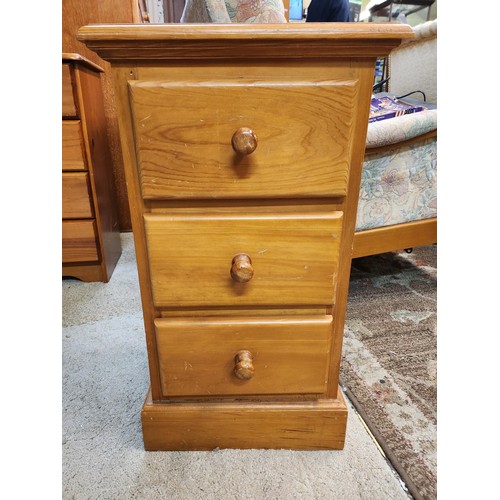 243 - A PINE BEDSIDE CHEST OF 3 DRAWERS