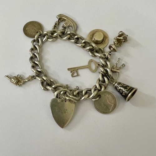 263 - UNUSUAL SILVER CHARM BRACELET -SILVER PADLOCK MARKED 'GJ Ltd' -GEORG JENSEN, THE LINKS MARKED WITH A... 