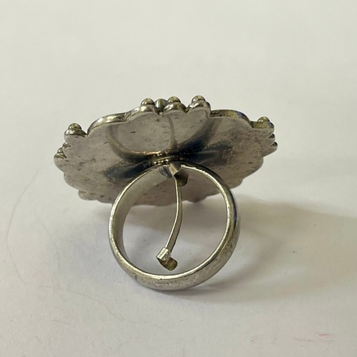 264 - A LARGE STERLING SILVER RING WITH SILVER RING SIZER INSERT, A LARGE CENTRAL CARNELLIAN STYLE STONE W... 