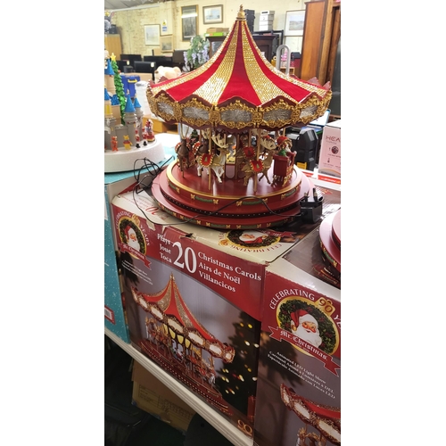 108 - XMAS LIGHTED CAROUSEL - ANIMATED LED LIGHT SHOW - PLAYS 20 TUNES AND TURNS -BOXED (ONE SMALL STRIP O... 