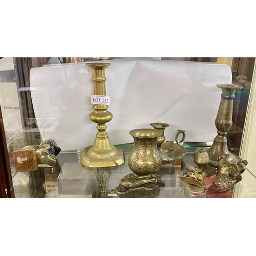 247 - A SHELF OF MISCELLANEOUS VINTAGE BRASSWARES INC. CANDLESTICKS, PUTTI, MIDDLE EASTERN VASE ETC.