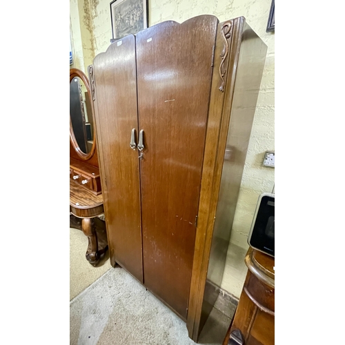 292 - A VINTAGE LEBUS OAK TWO DOOR ROBE WITH FITTINGS AND KEY