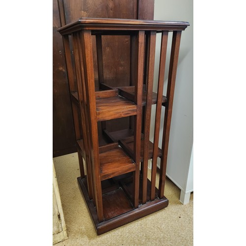 281 - A MAHOGANY THREE TIER REVOLVING LIBRARY BOOKCASE - 110CM HIGH X 50CM DEEP