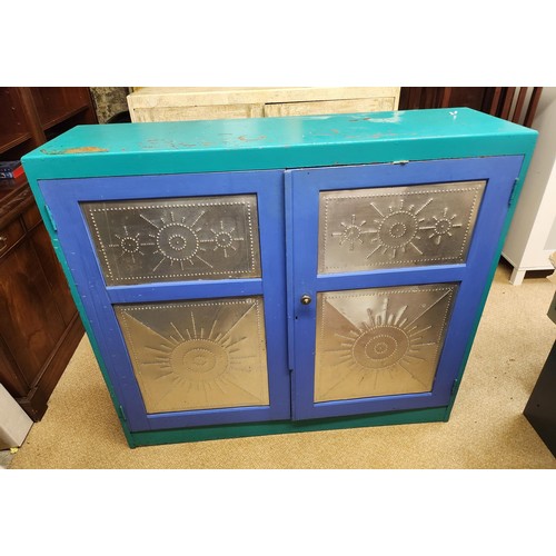 278 - A SHABBY CHIC GREEN/BLUE DECORATED WITH METAL PANELS CUPBOARD - 121CM WIDE X 107CM HIGH X 36CM DEEP