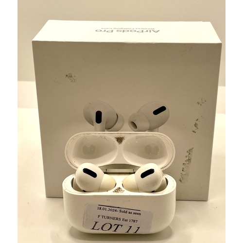 11 - BOXED PAIR OF APPLE AIR POD PRO'S WITH CHARGING WIRE AND EXTRA BUDS SHOWING SIGNS OF USAGE