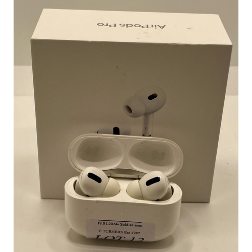 12 - BOXED PAIR OF APPLE AIR POD PRO'S WITH CHARGING WIRE AND EXTRA BUDS SHOWING SIGNS OF USAGE (WORK FIN... 