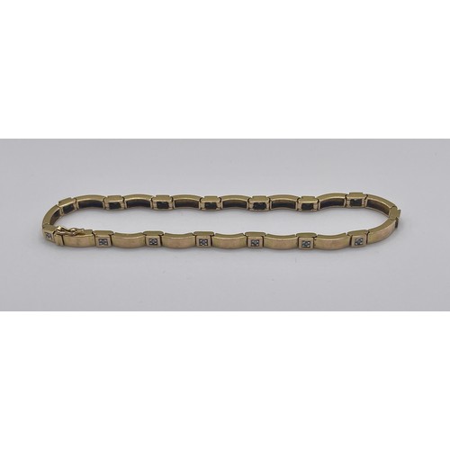 345 - 9CT YELLOW GOLD ARTICULATED BAR BRACELET IN SET WITH 15 DIAMOND CHIPS OF APPROX 0.15CT'S 8.7G