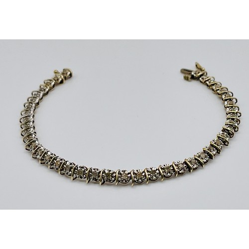 350 - A 9CT WHITE & YELLOW GOLD, DIAMOND TENNIS OR LINE BRACELET - A FANCY FLORAL SET LINE BRACELET ENCLOS... 