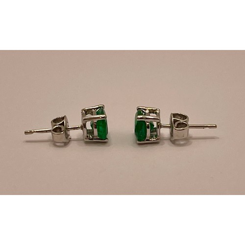 365 - A PAIR OF CLAW SET OVAL EMERALD AND WHITE GOLD EARRINGS - TESTED AS 14CT WHITE GOLD -EACH EMERALD AP... 