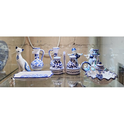 317 - SMALL QTY OF BLUE AND WHITE POTTERY - APPROX 10 PIECES - SALT AND PEPPER SHAKERS, CANDLESTICKS, JUGS... 