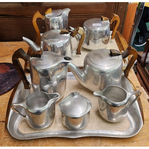 325 - 10 PIECE PICQUOT WARE ALUMINIUM TEA SET INC. TWO TRAYS, TEAPOT, COFFEE POT, MILK AND SUGAR